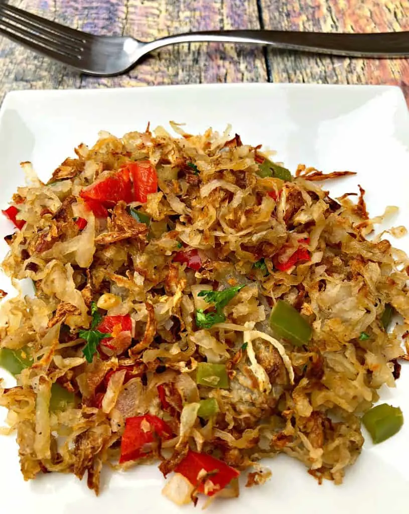 close up photo of air fryer hash browns on a white plate