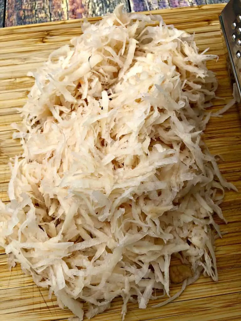 shredded potatoes on a cutting board