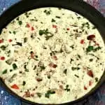 Post-Workout Egg White and Bacon Frittata Protein Recipe in a black cast iron skillet