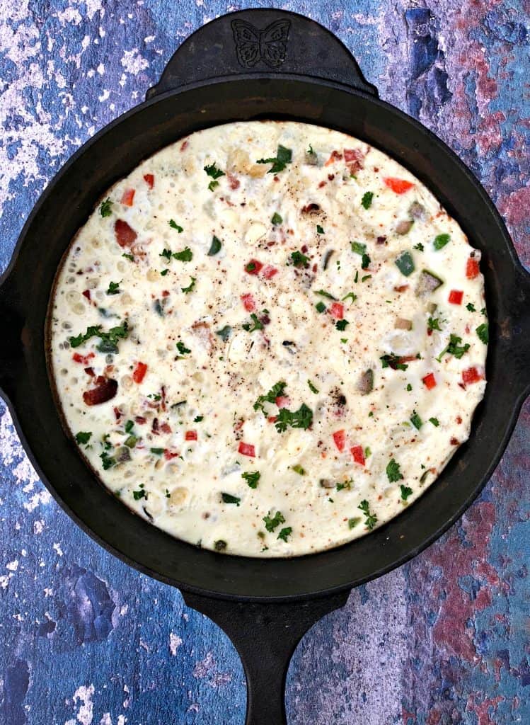 Post-Workout Egg White and Bacon Frittata Protein Recipe in a black cast iron skillet