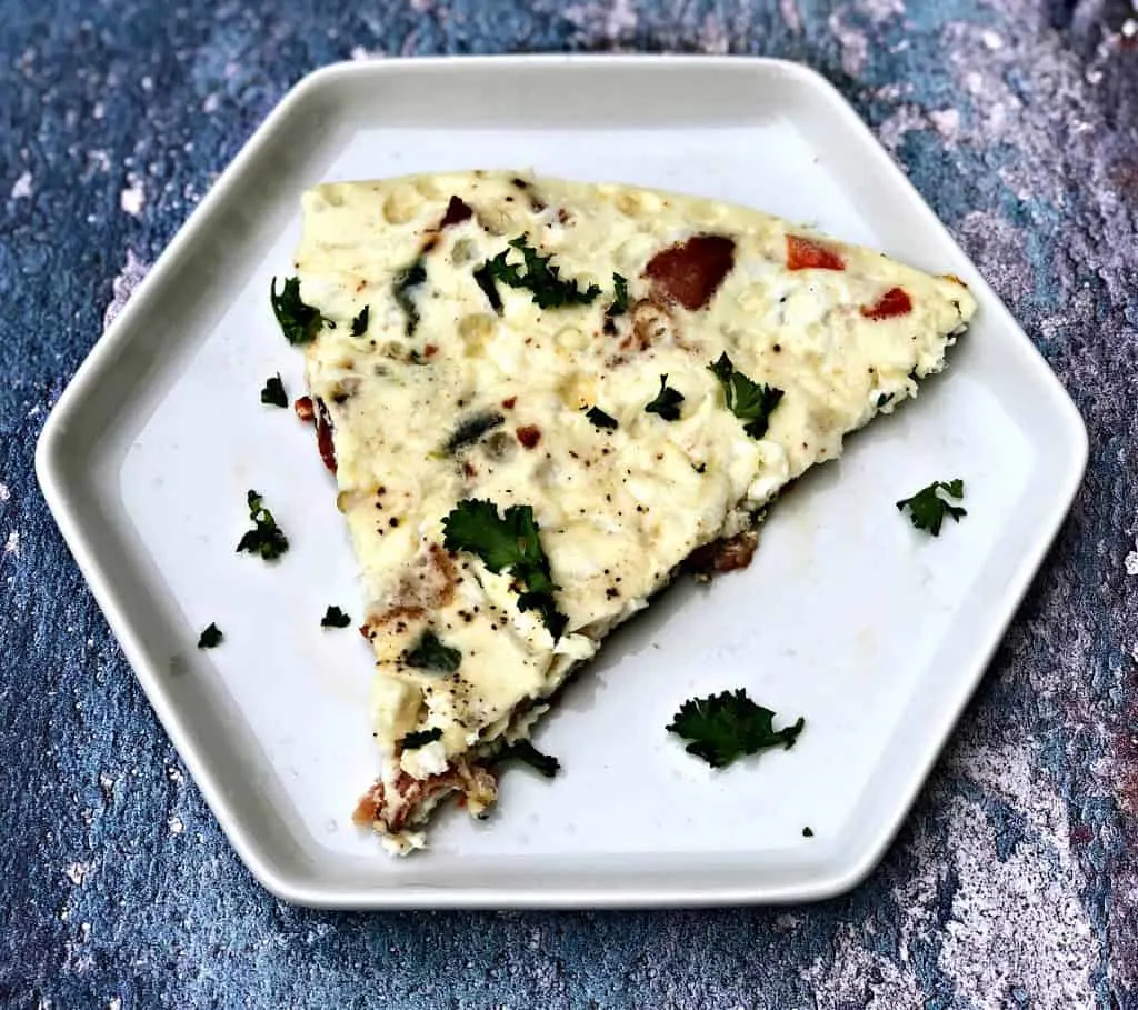 one piece of Post-Workout Egg White and Bacon Frittata Protein Recipe on a white plate
