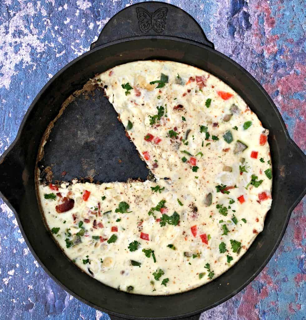 Post-Workout Egg White and Bacon Frittata Protein Recipe in a black cast iron skillet