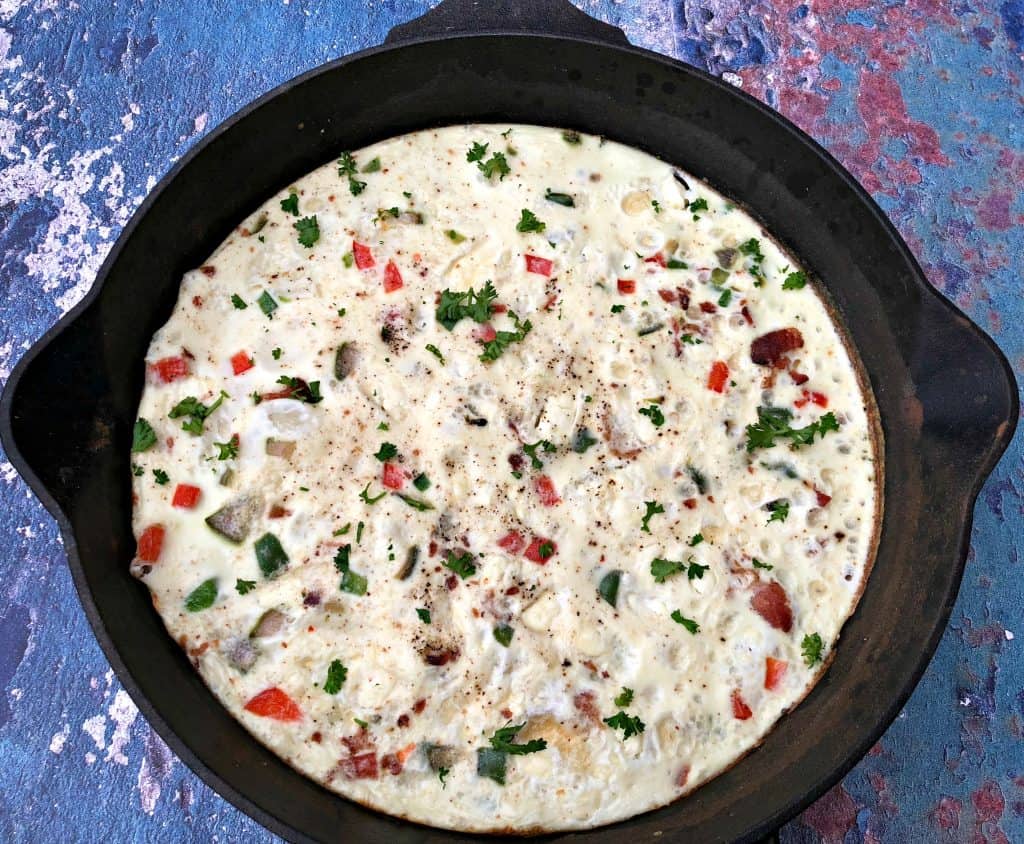 Post-Workout Egg White and Bacon Frittata Protein Recipe in a black cast iron skillet