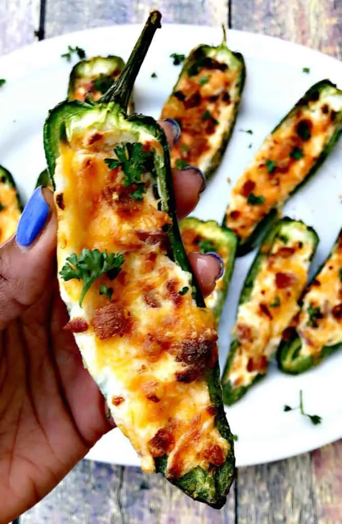 cooked jalapeno popper held in a hand