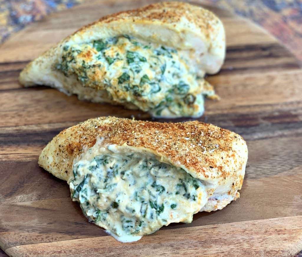 keto low carb stuffed chicken breasts on a brown plate