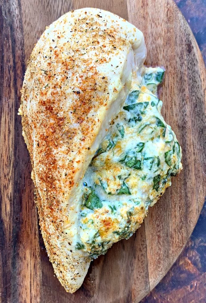 keto low carb stuffed chicken breasts on a brown plate