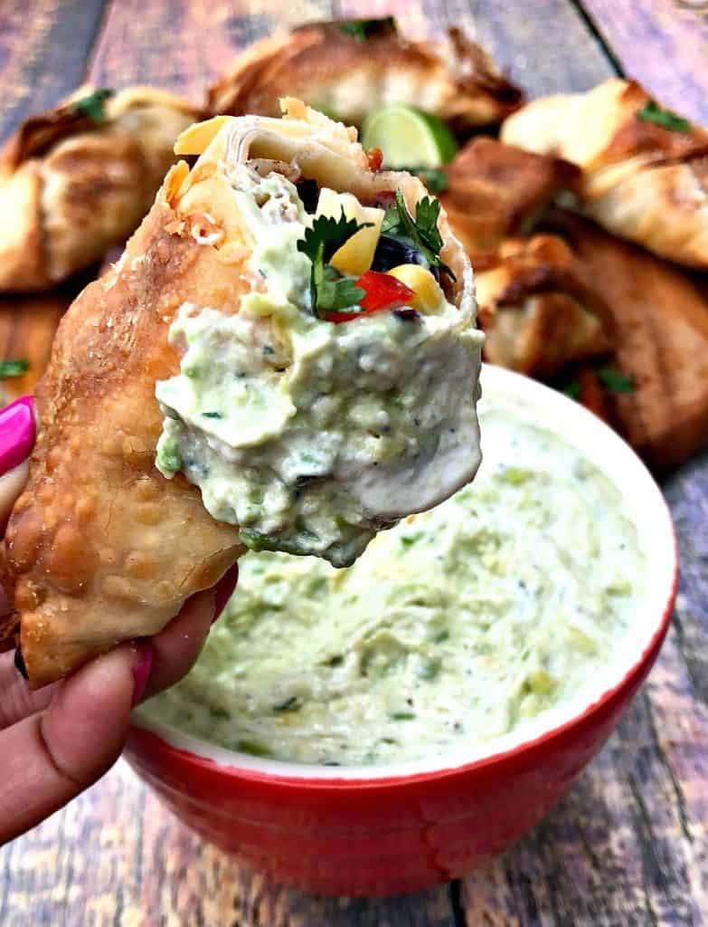 air fryer southwestern egg roll cut in half with avocado ranch dip