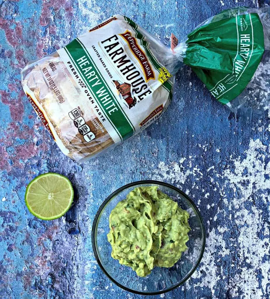 guacamole and bread on blue surface