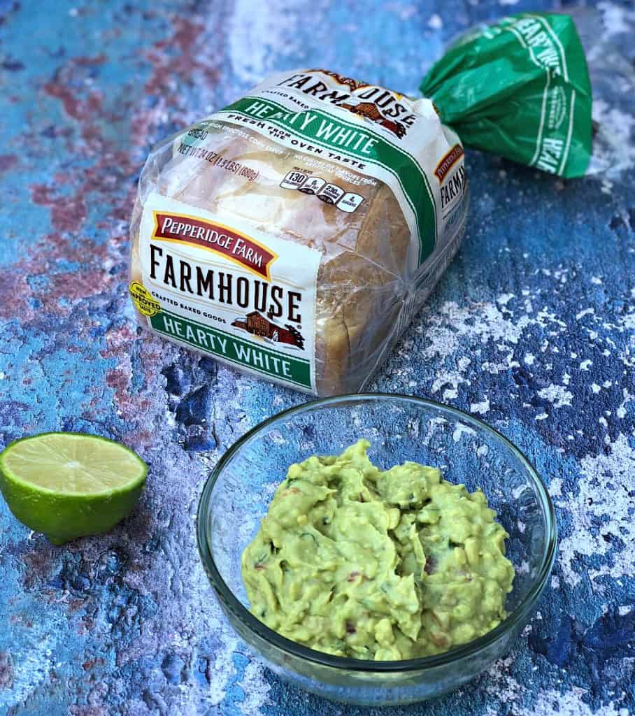 guacamole and bread on blue surface