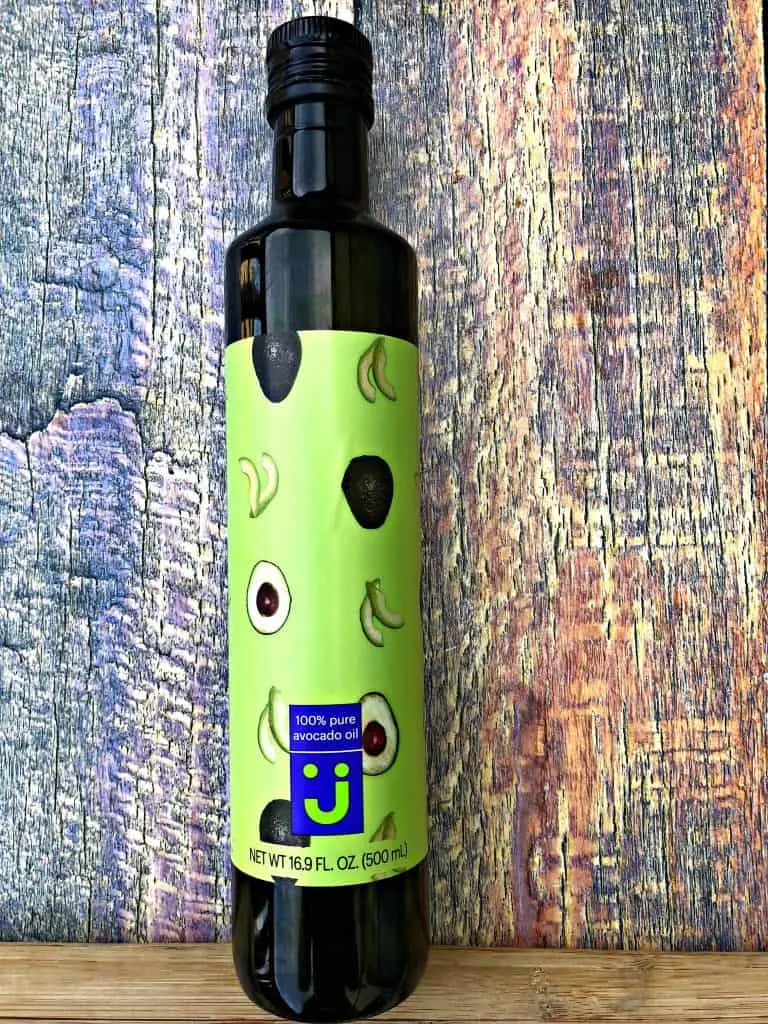 avocado oil bottle on a multi color surface