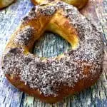 Air Fryer Cinnamon Sugar Donuts on a multi colored surfaced