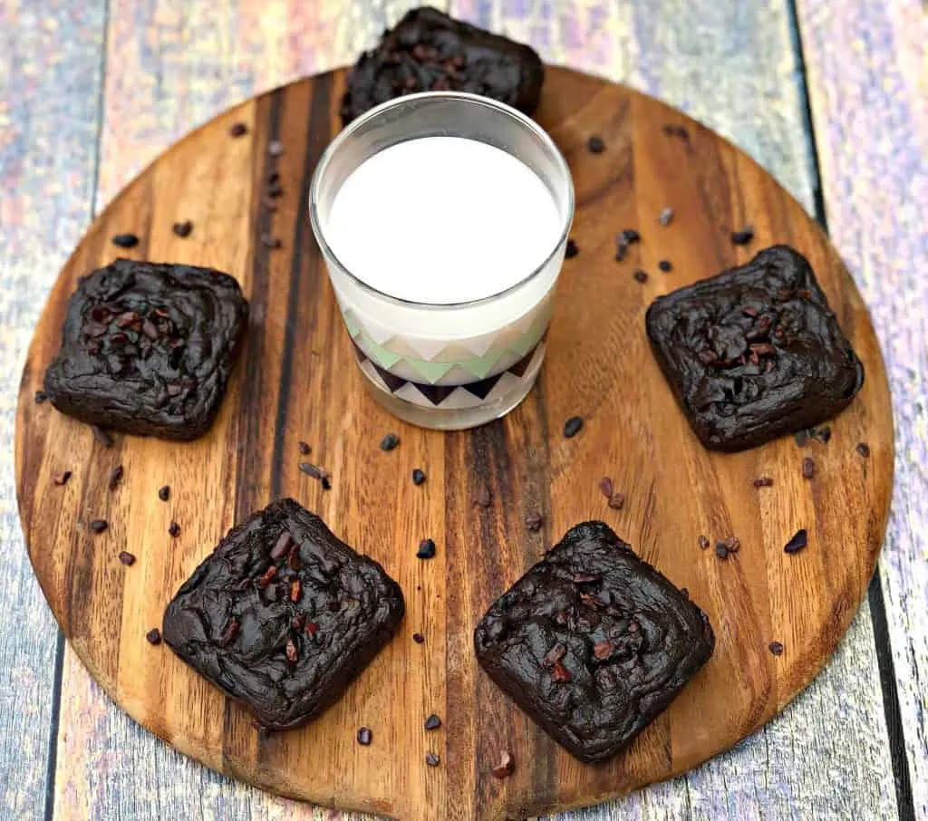 avocado brownies with milk on a brown cutting board