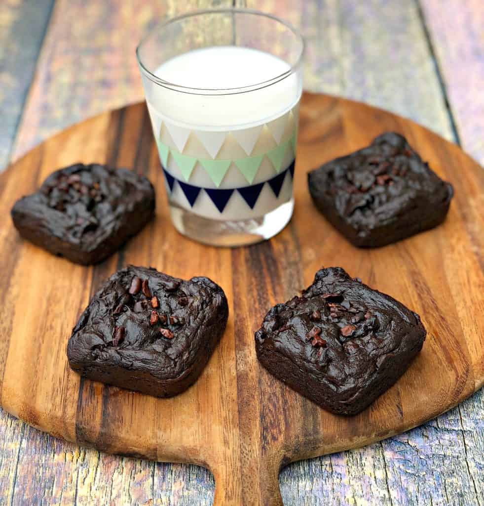 avocado brownies with milk on a brown cutting board