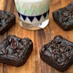 avocado brownies with milk on a brown cutting board