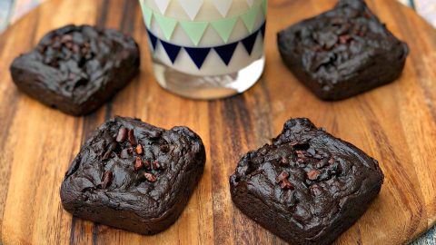 avocado brownies with milk on a brown cutting board