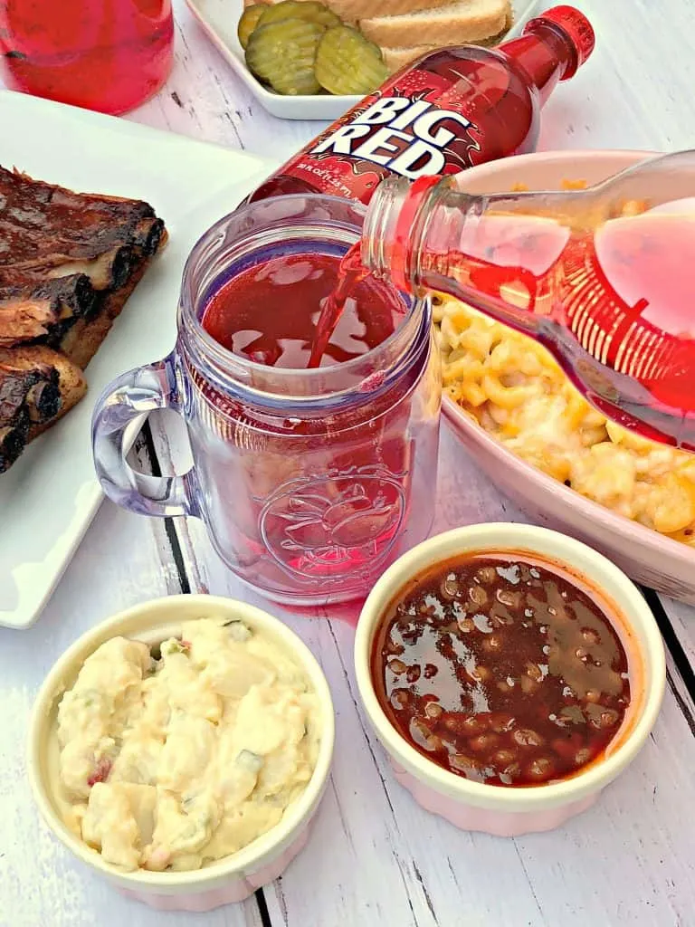 mac and cheese, red soda, with side dishes