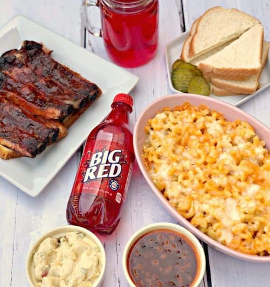 big red 4 mac and cheese, red soda, with side dishes