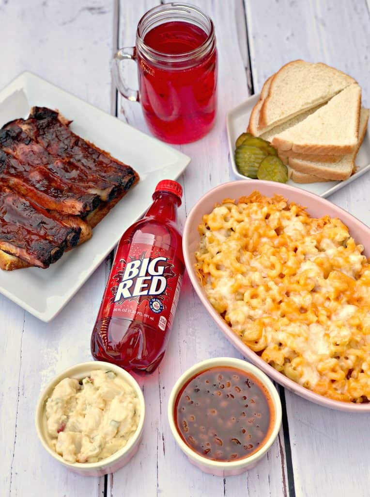 mac and cheese, red soda, with side dishes