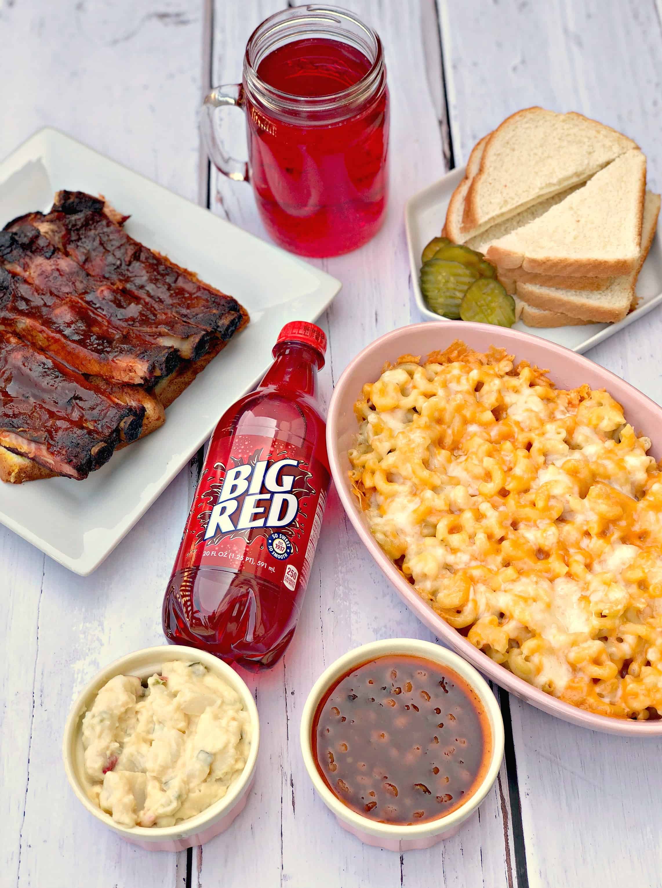 mac and cheese, ribs, red soda, with side dishes