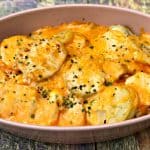 instant pot scalloped potatoes in a pink bowl