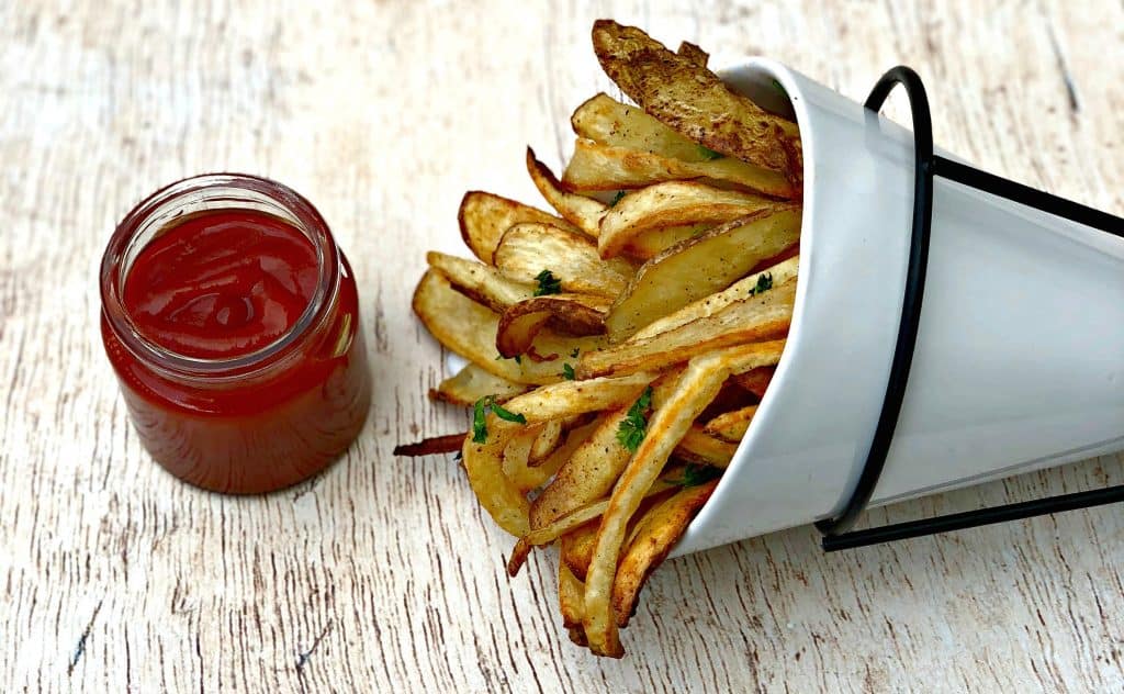 air fryer fries in a white can with ketchup