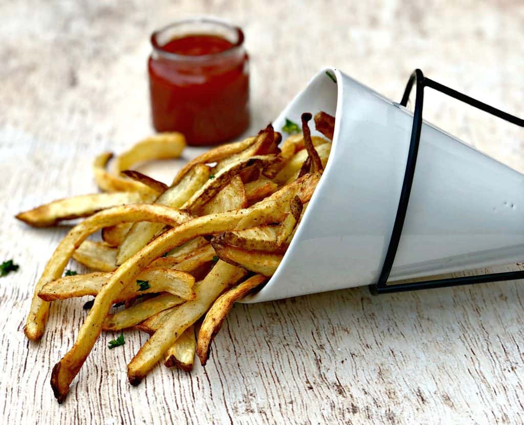 air fryer fries in a white can with ketchup