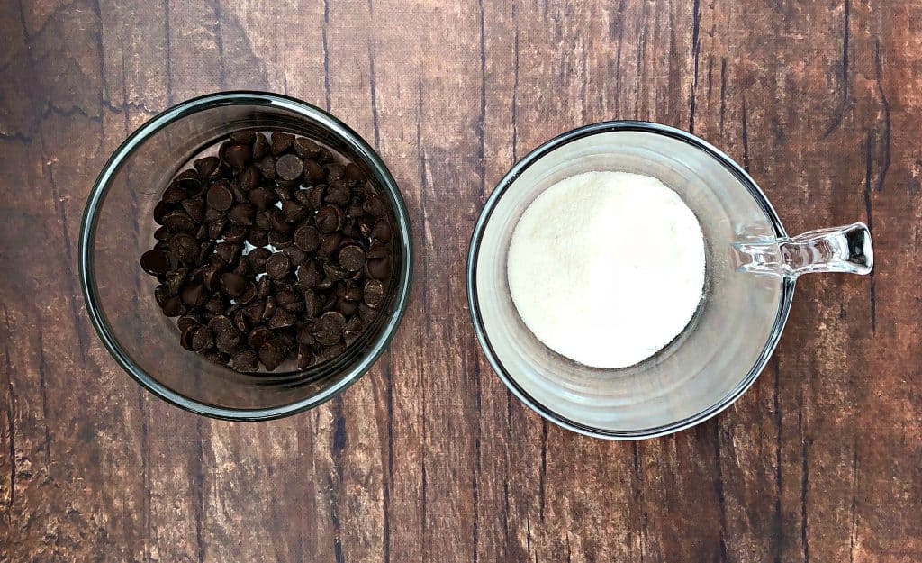 bowl with chocolate chips and a cup with sugar