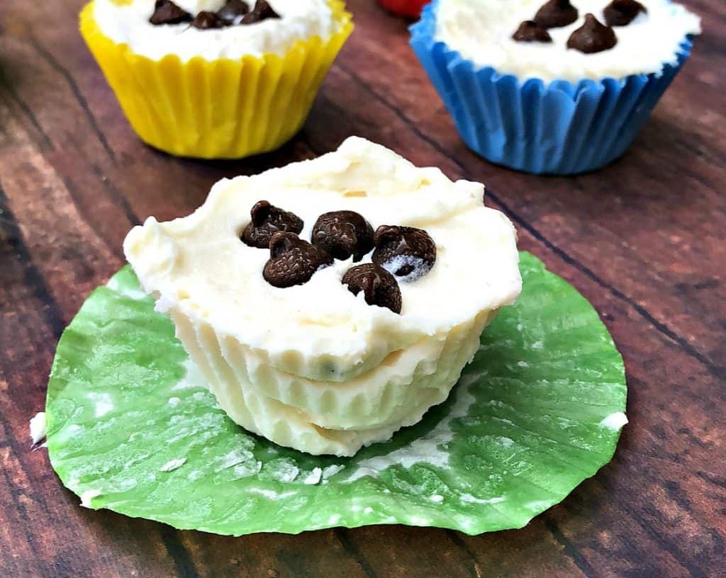 cheesecake fat bombs on a flat surface