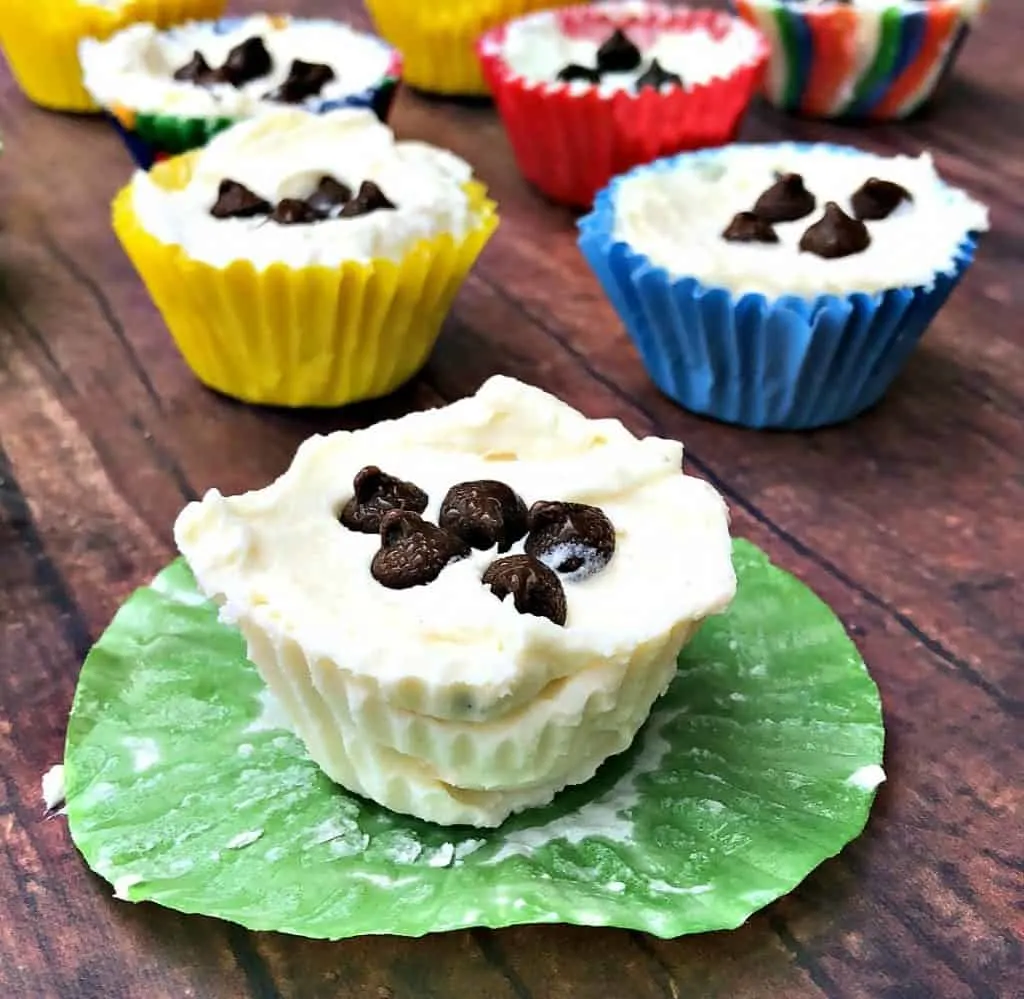 cheesecake fat bombs on a flat surface