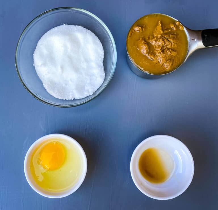 natural peanut butter, sugar, egg, and vanilla in bowls