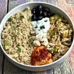 mediterranean chicken bowl in a white bowl