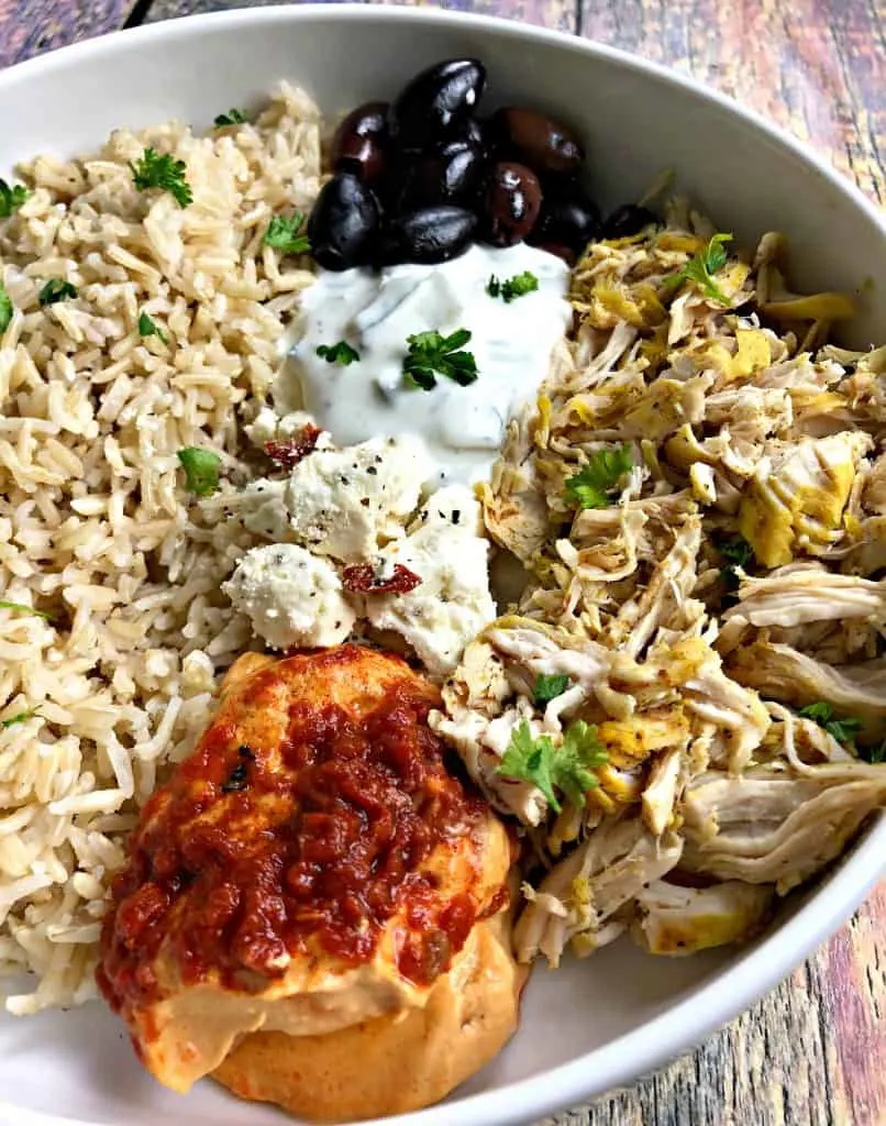 close up photo of mediterranean chicken bowl in a white bowl