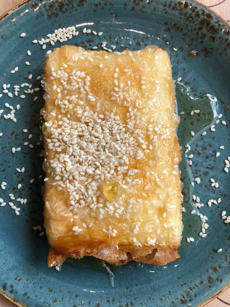 fried feta cheese on a blue plate