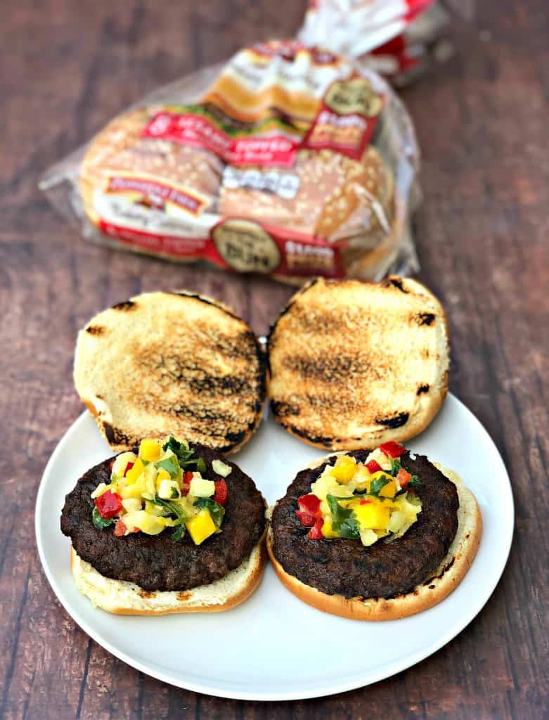 grilled burgers with tropical salsa on a plate
