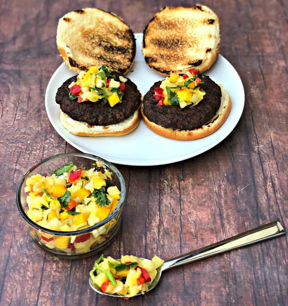 grilled burgers with tropical salsa on a plate