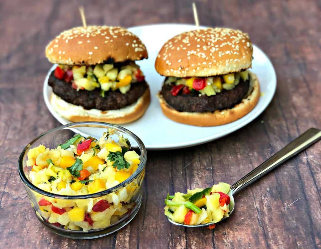 grilled burgers with tropical salsa on a plate