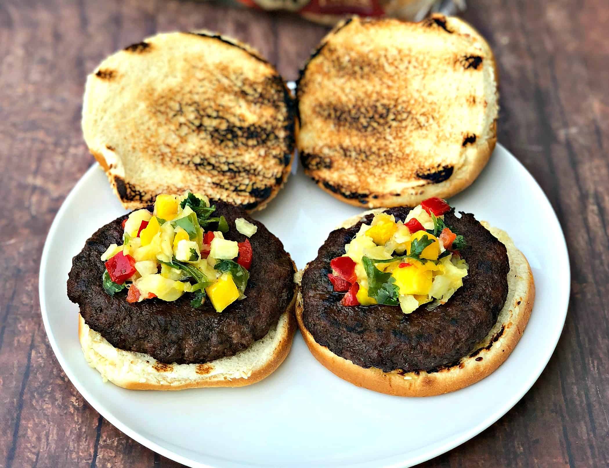 grilled burgers with tropical salsa on a plate