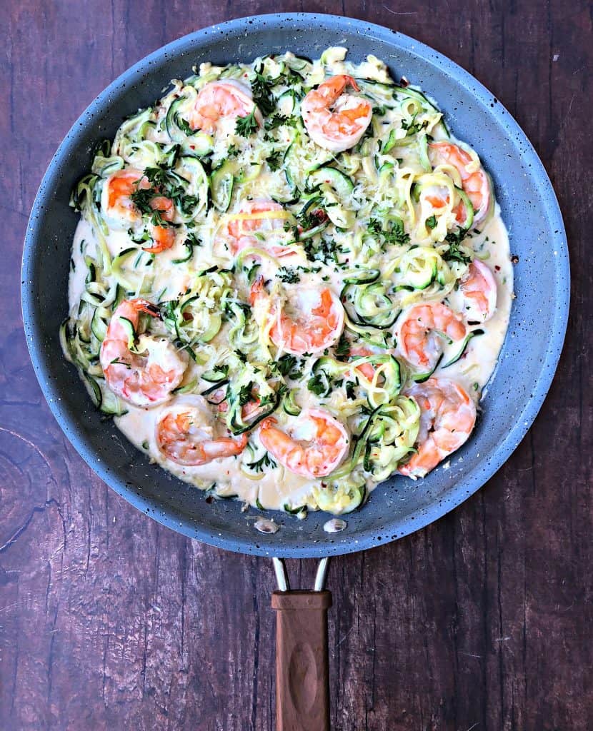 low carb zucchini alfredo in cream sauce in a skillet