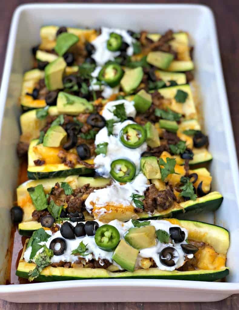 zucchini nachos with olives and sour cream