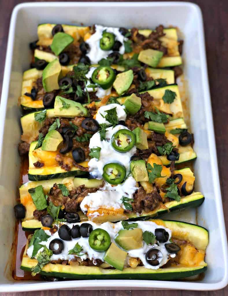 zucchini nachos with olives and sour cream