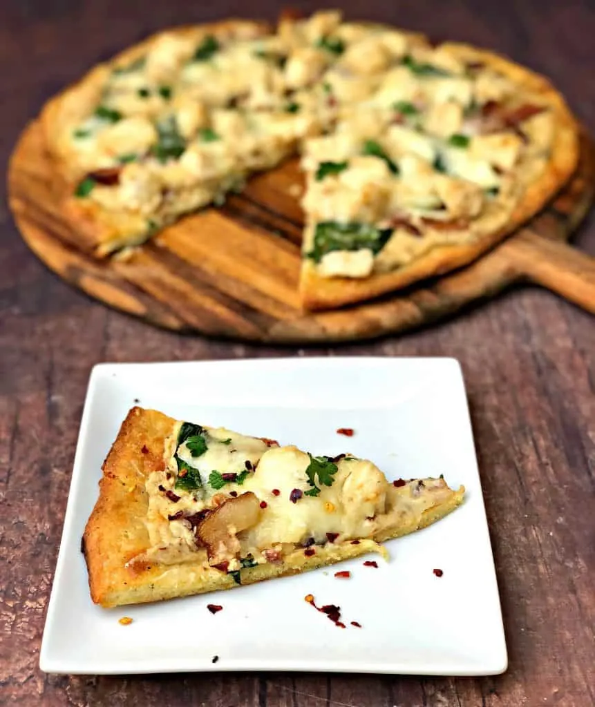 keto fathead alfredo bacon chicken pizza sliced and on a plate