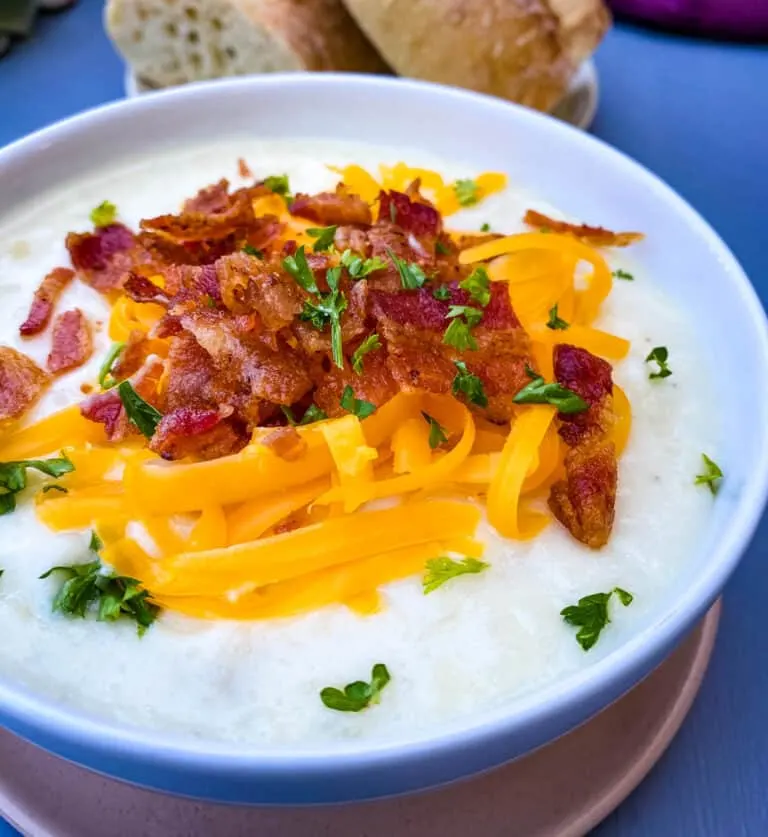 instant pot potato soup with bacon and cheese in 3 bowls