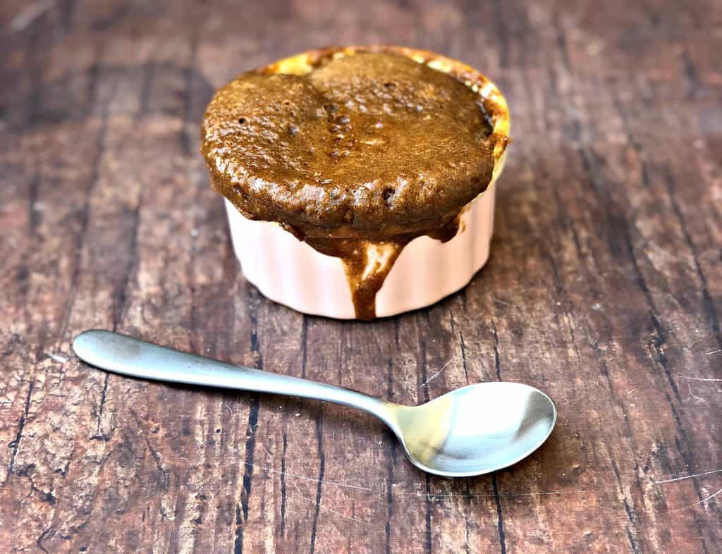 keto peanut butter chocolate chip mug cake in pink bowl