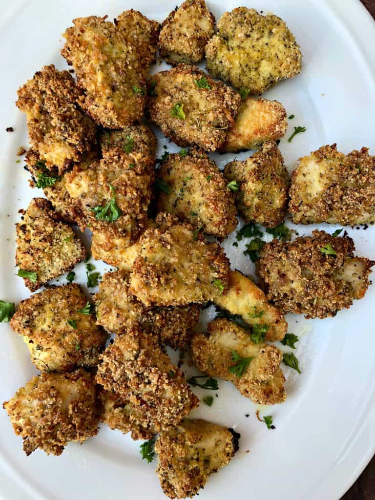 2 keto bacon chicken nuggets on a white plate