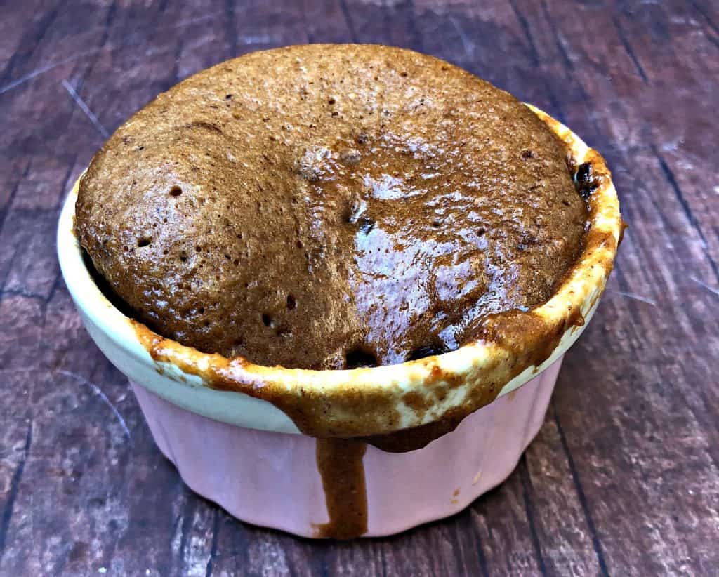 keto peanut butter chocolate chip mug cake in pink bowl