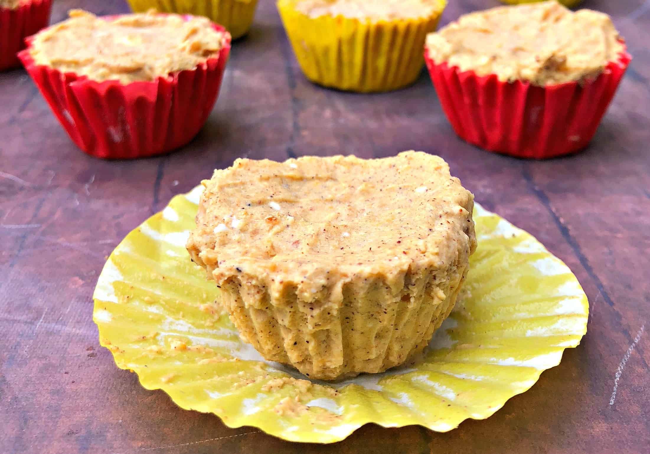 pumpkin spice bombs in a yellow wrapper on a brown surface