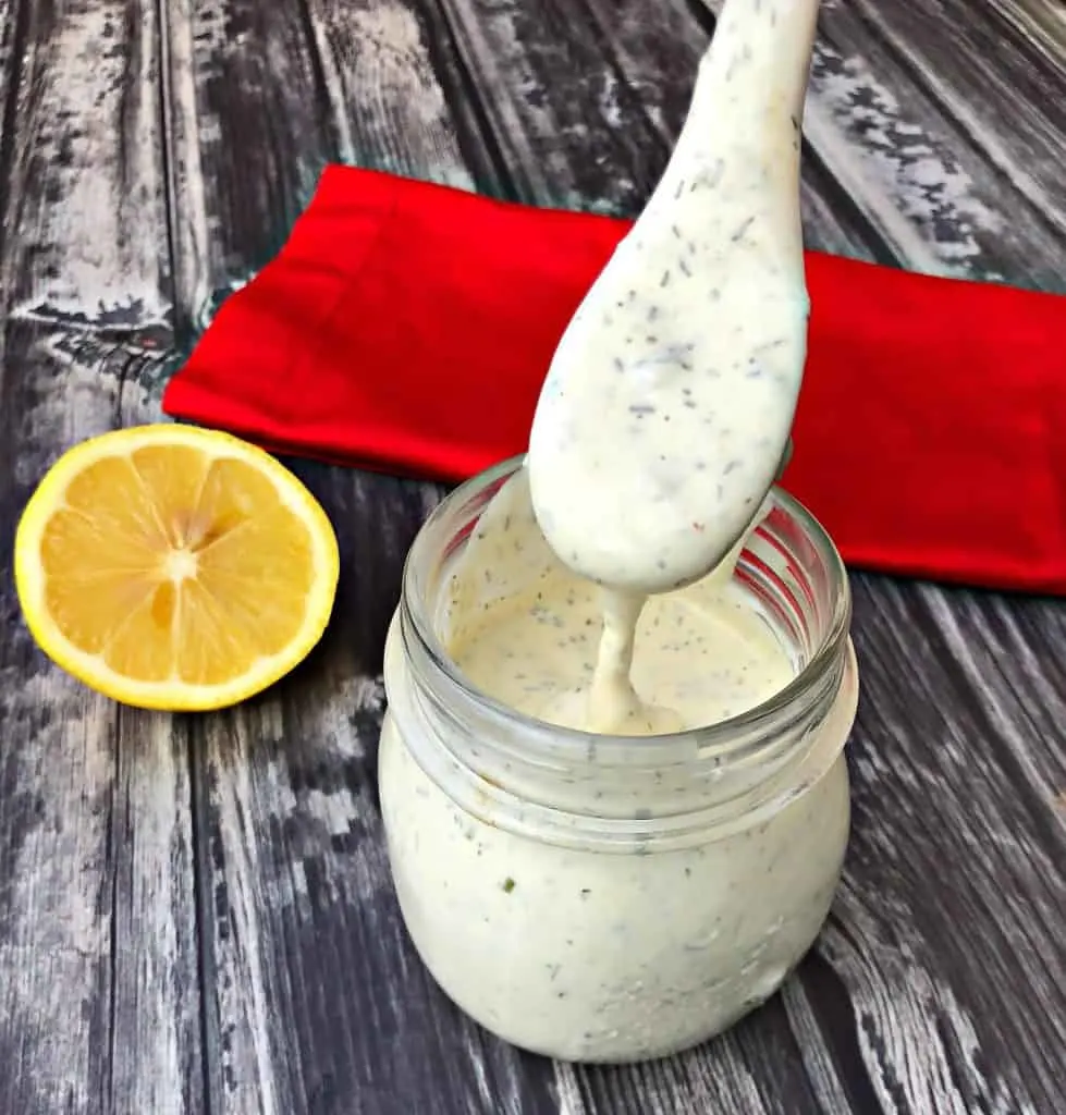 keto low carb ranch dressing with a spoon with lemon