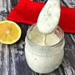 keto ranch dressing in a glass jar with a spoon