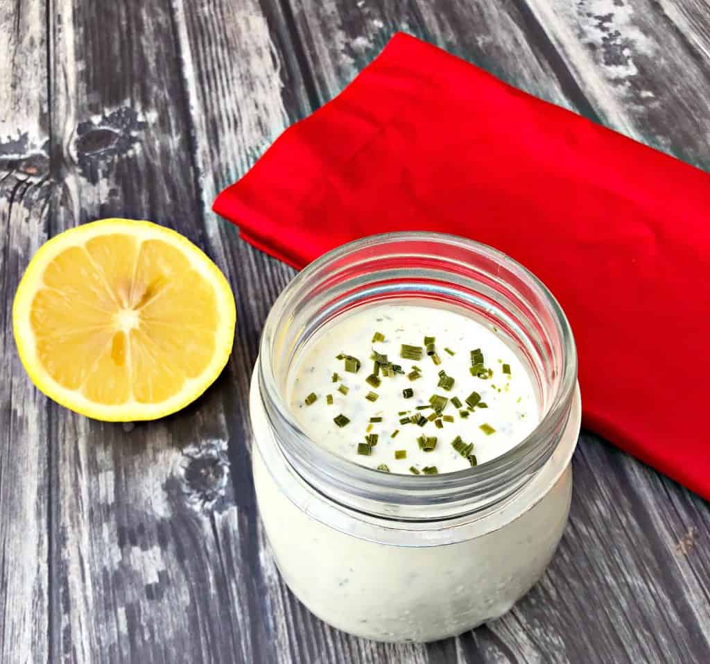 keto low carb ranch dressing with a spoon with lemon