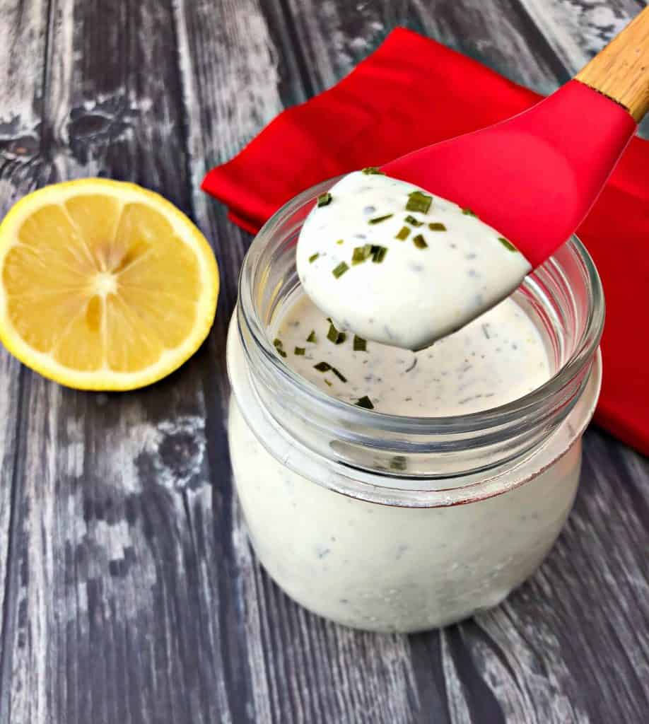 keto low carb ranch dressing with a spoon with lemon